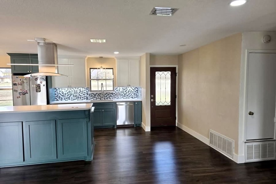 Kitchen renovation Waco TX – teal island kitchen entry view
